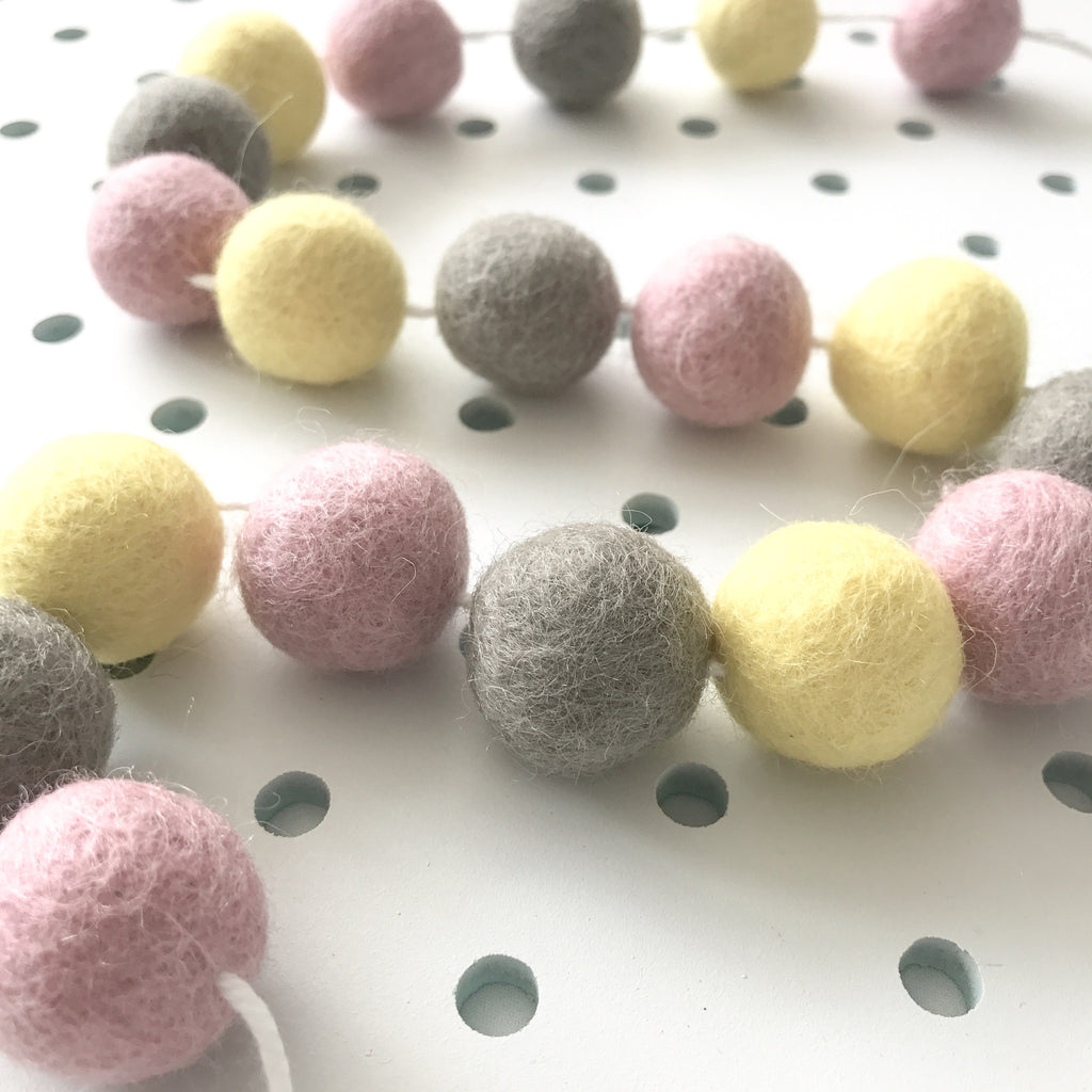 Stone and Co Felt Ball Pom Garland in Pastel Yellow, Dove and Dusty Pink - stoneandcoshop