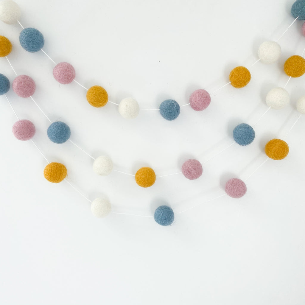 Felt Ball Pom Pom Garland in Mustard, Blue, Pink and White By Stone And Co
