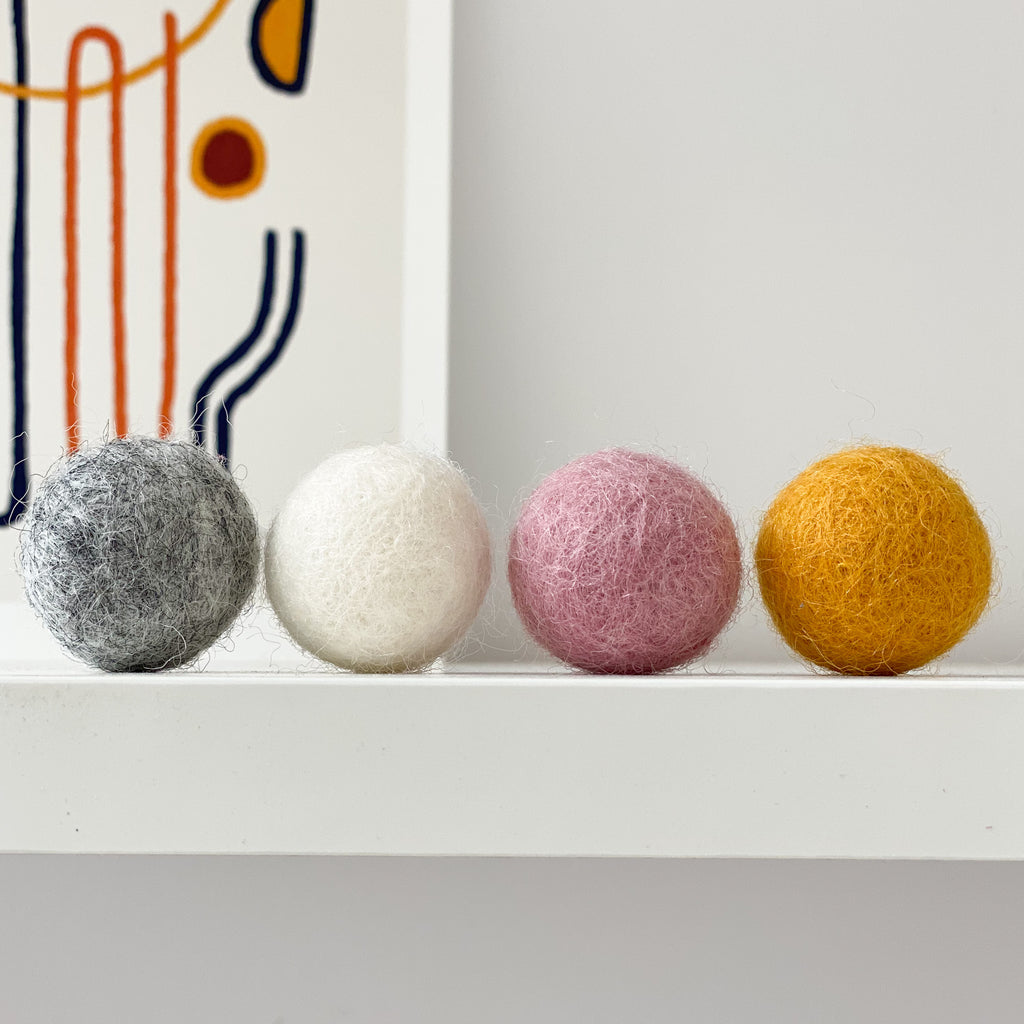 Felt Ball Pom Pom Garland In Dusty Pink, Natural Grey, Mustard and Natural White by Stone and Co